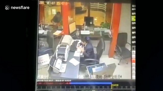 Bank staff terrified by cat randomly falling from the ceiling