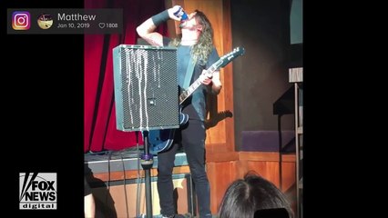 CRAZY VIDEO: Rock star chugs beer, then falls off stage