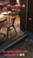 Patice Evra catches a mouse in a restaurant