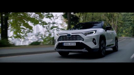 The new Toyota RAV4 Hybrid Driving in the country