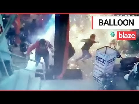 Moment Balloons Cause an Inferno at Xmas Market | SWNS TV