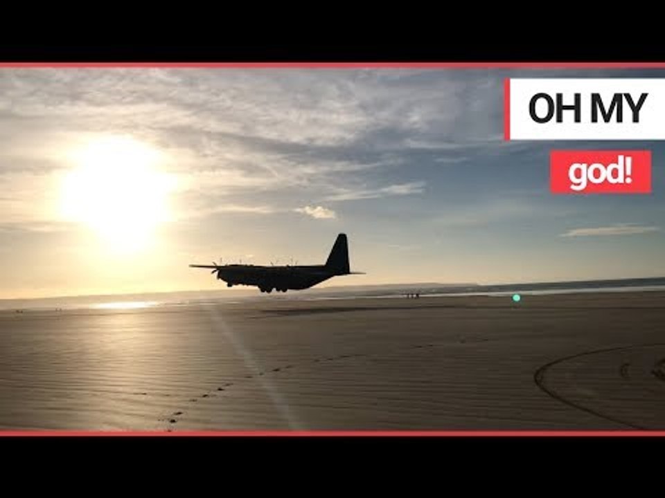 Incredible video shows the moment a Hercules plane lands on a British beach | SWNS TV