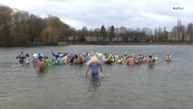 Dozens of brave aliens dressed Berliners plunge into icy lake