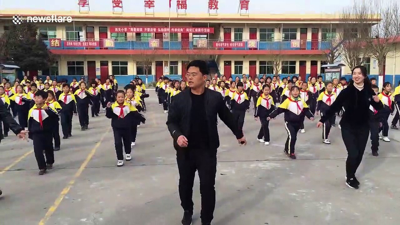School pupils do choreographed shuffle dance wi...