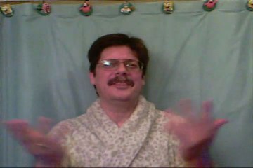 1074. THE CUTE SEA OTTER SLEEPS IN A LOVING KIND OF WAY.