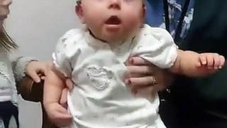Baby girl can't hide her happiness at hearing sister's voice clearly for first time