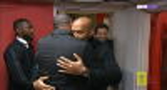 Henry and Vieira embrace before the action begins