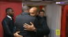 Henry and Vieira embrace before the action begins