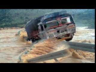 Heavy Truck & Cars Crossing the Heavy Flood River