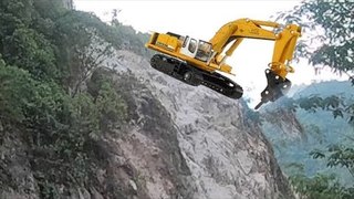 Excavator Works The Mountain And Roadside