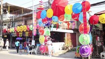 Tourists enjoy colourful umbrella festival in northern Thailand