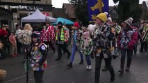 Straw bears parade through English village in annual event