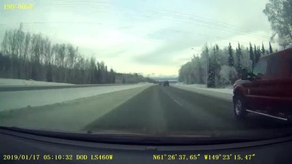 Truck Slides into Snow Filled Median Strip
