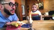 Dad entertains his kid by beatboxing with a candle flame