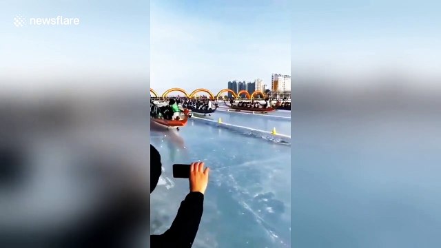 Dragon boat race held on frozen river using ice picks instead of paddles