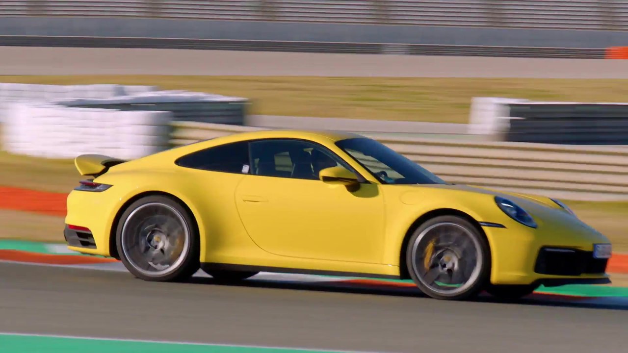 Porsche 911 Carrera 4S in Racing Yellow on the Race Track