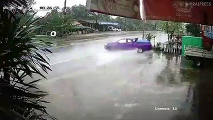 Pick-Up Truck Skids Off Wet Road