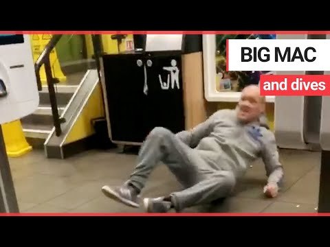 McDonald's customer loses his balance and falls over | SWNS TV