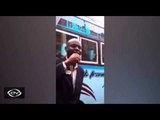 Raila impersonator entertains at a bus stop