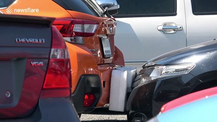 Drivers forced to PUSH vehicles to exit busy Bangkok car park