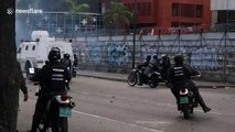 Police officers clashes with civilians in Caracas
