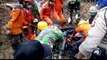 Search and rescue team evacuates landslide casualty in the wake of deadly Indonesia floods