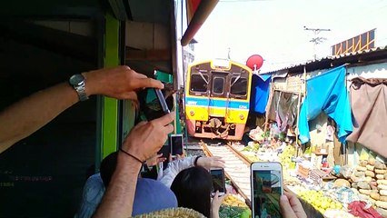 Train through Thai market