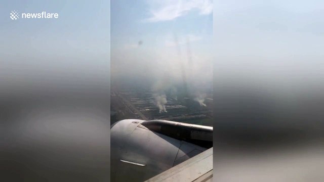 Aerial footage shows Thai farmers burning crops in smog-ravaged Bangkok