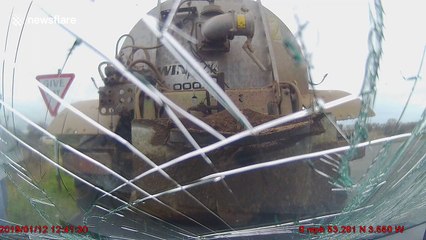 Dash-cam shows moment tractor reverses into car windshield in north Wales