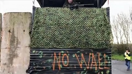 Raw Moment: Protesters dressed as soldiers create 'Brexit border wall' on island of Ireland