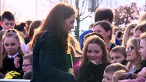 Young girl strokes Kate's hair