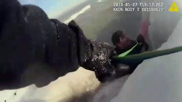 Dramatic footage shows man being rescued from icy lake