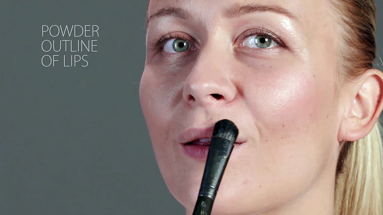 applying lipstick