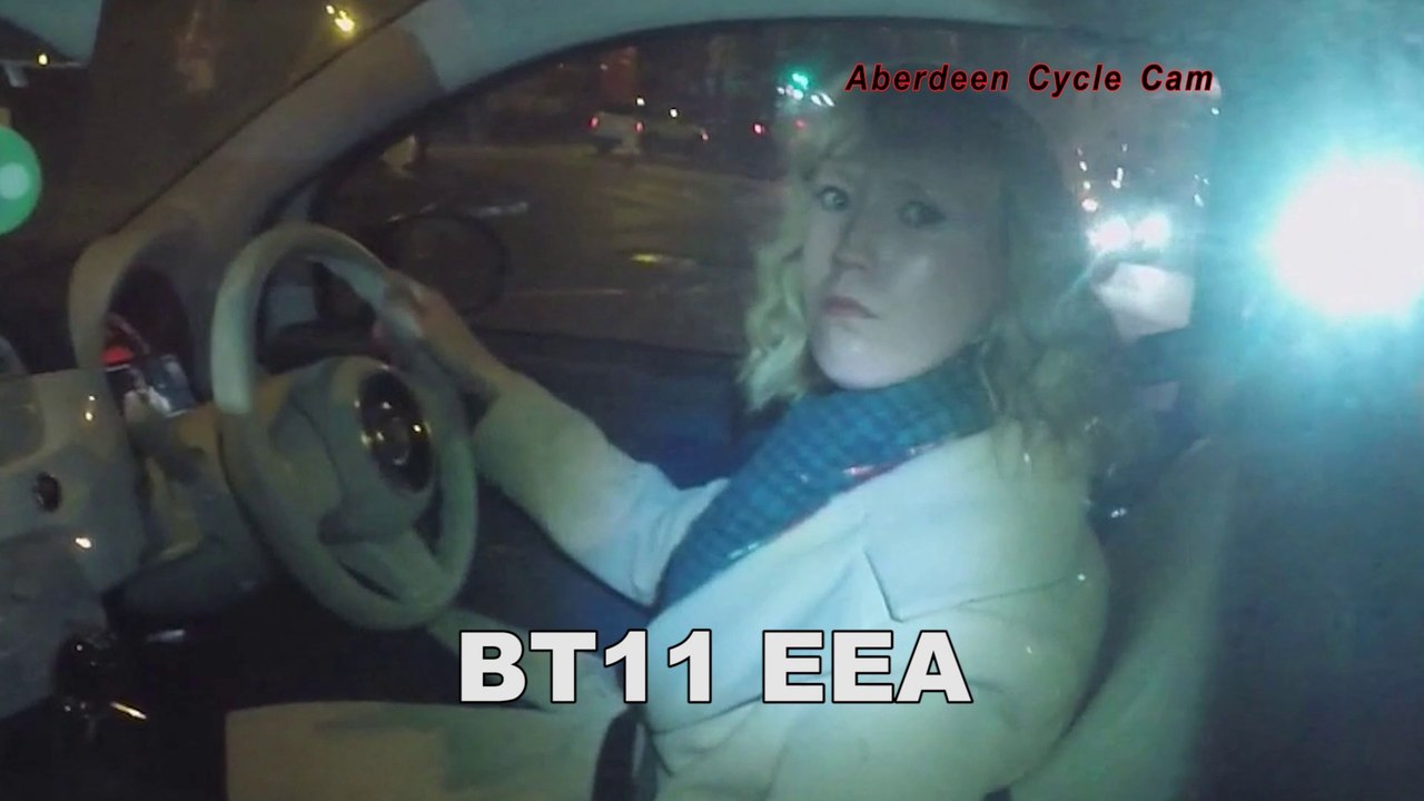 BT11EEA - Mobile phone covering dashboard with paused video - Haudagain Roundabout, Aberdeen