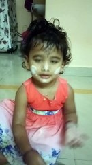 Little girl thinking she is making the chipati!