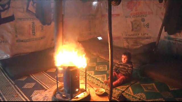 Syrian refugees burn plastic to survive harsh winter