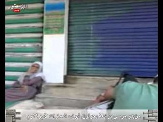 مؤيدو مرسي برابعة يحولون أبواب العمارات لأسِرة نوم