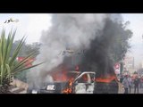 إخوان جامعة القاهرة يشعلون النار في سيارة شرطة