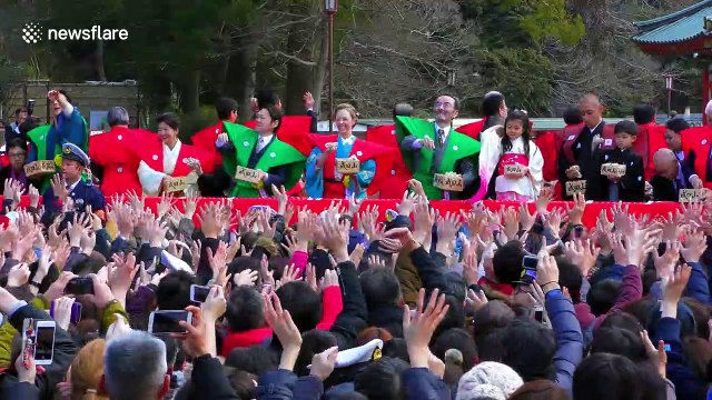 Sumo grand champion Hakuho tosses beans at 'setsubun' festival in Japan