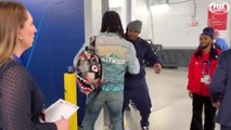 Todd Gurley runs into Marshawn Lynch on his way to Super Bowl LIII postgame press room