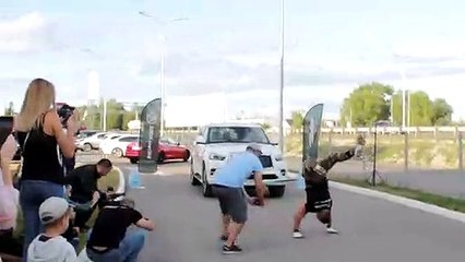 Guy Pulls Car While Doing Handstand