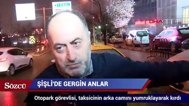 Otopark görevlisi, tartıştığı taksicinin arka camını kırdı