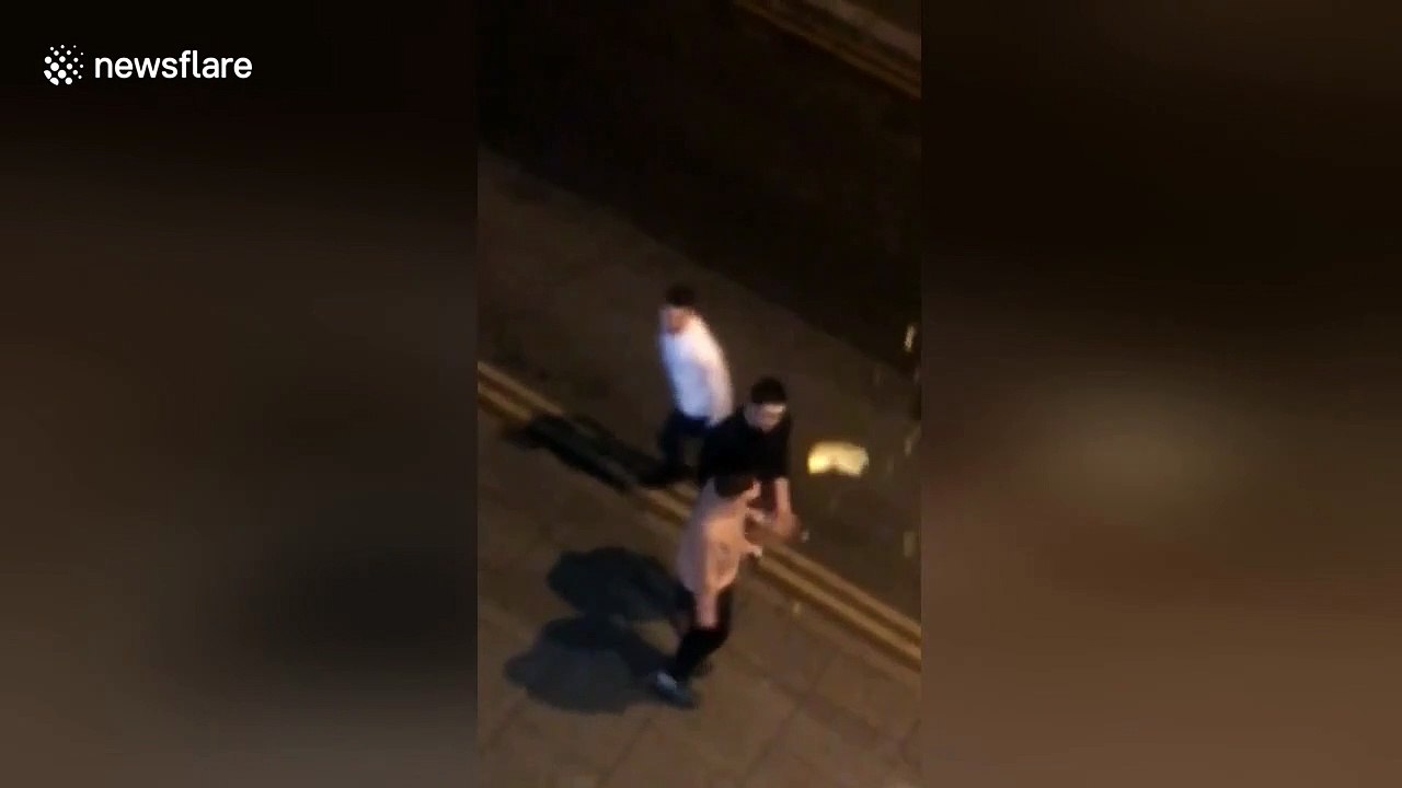 Wahey! Student tumbles after friend smacks takeaway out of his hand