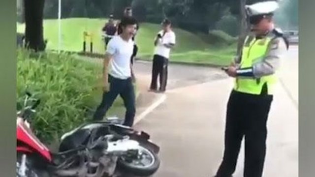 Indonesian motorcyclist throws tantrum after being ticketed