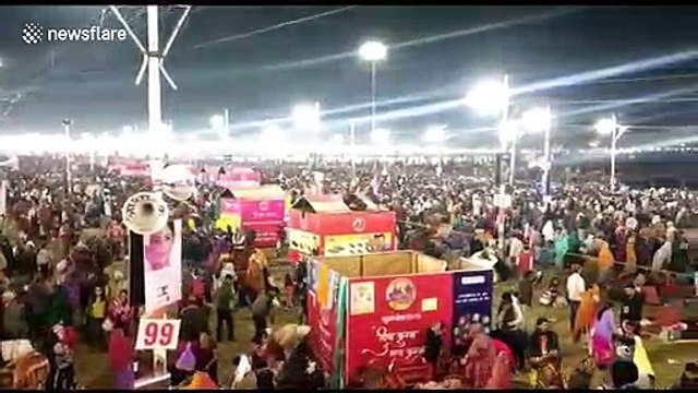 Twenty million Hindu devotees gather to bathe at Kumbh mela