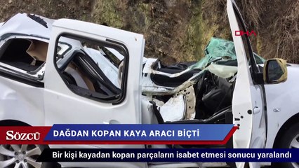 Dağdan kopan kaya aracı biçti