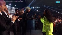 K-pop group BTS presents Grammy award to Filipino-American R&B artist H.E.R