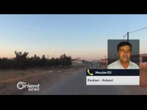 Salek li ser roja reş roja kumkujiya Kobanî derbas dibe