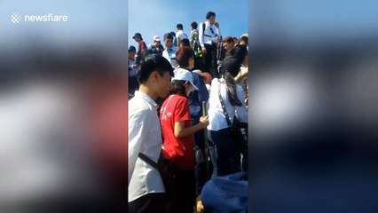Human traffic jam on holy Vietnam mountain top during Lunar New Year
