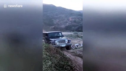 Hardtop Jeep turns into instant convertible after jump fail